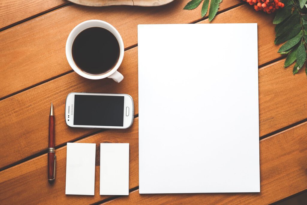 Desk basics: coffee, phone, note pads and pen